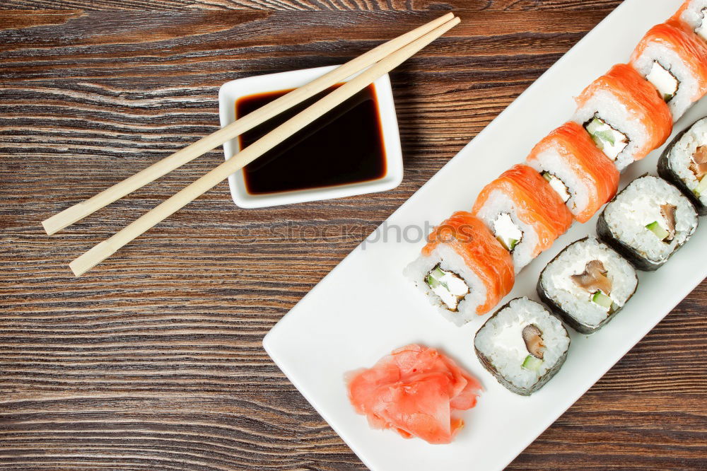 Similar – Crop woman eating sushi