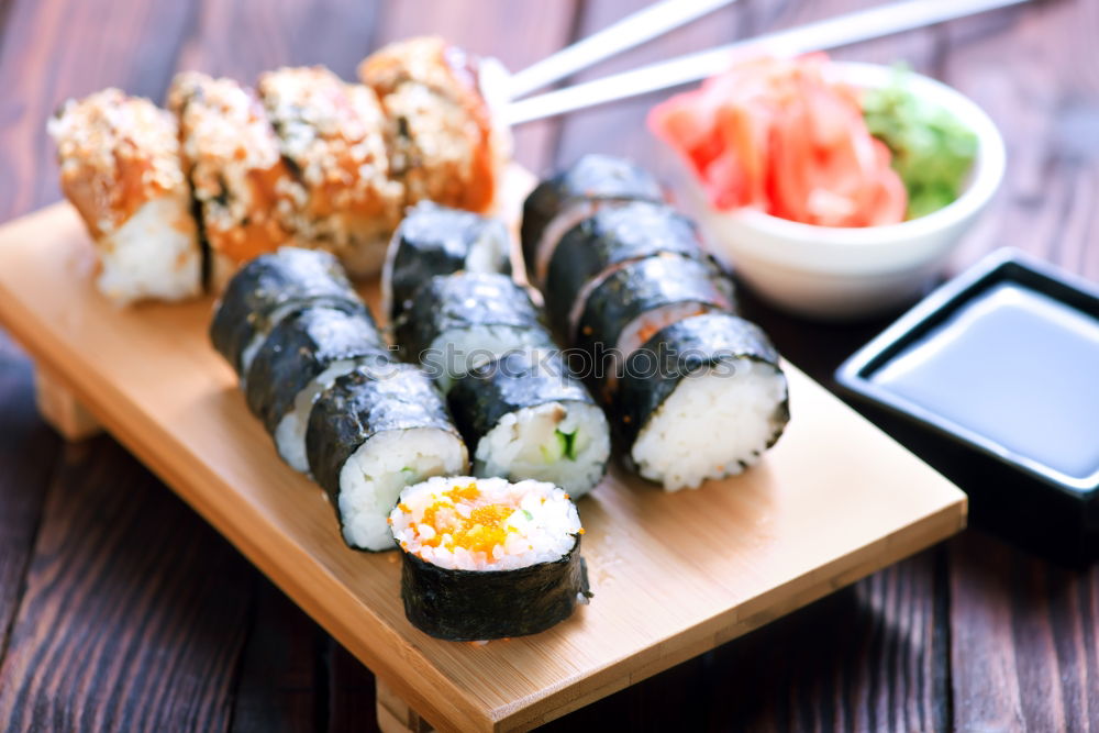 Similar – Crop woman eating sushi