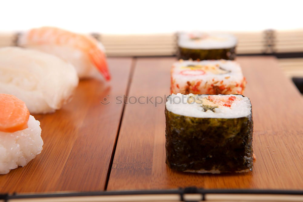 Similar – Image, Stock Photo Sushi set on pottery plate with chopsticks and soy sauce