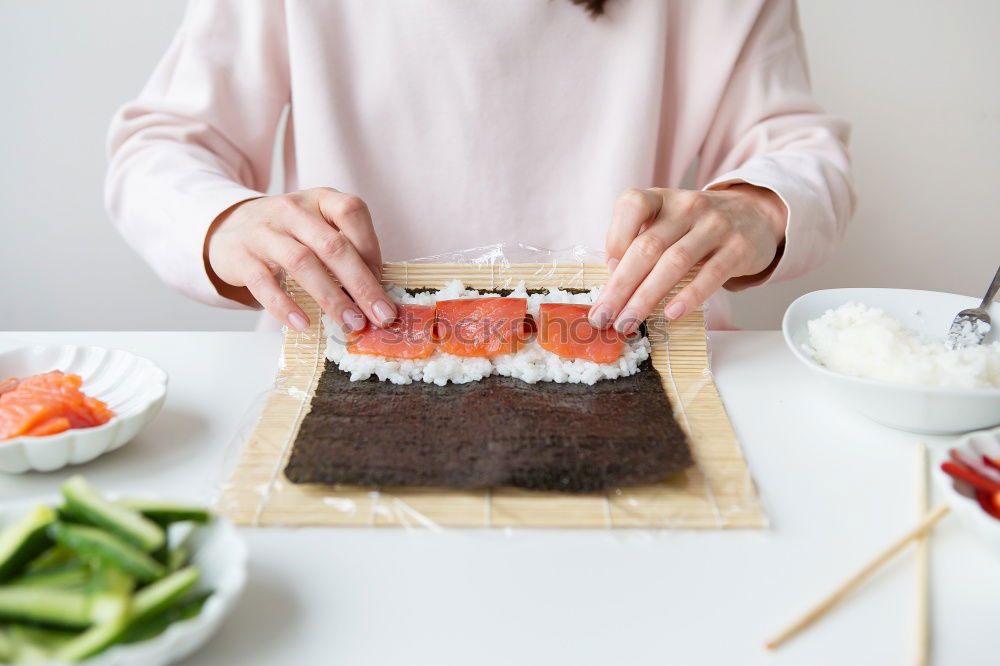 Similar – Crop woman eating sushi