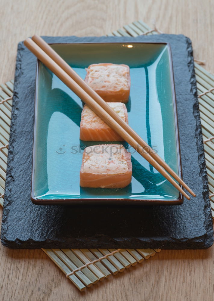 Similar – sushi assortment and soya sauce on black background