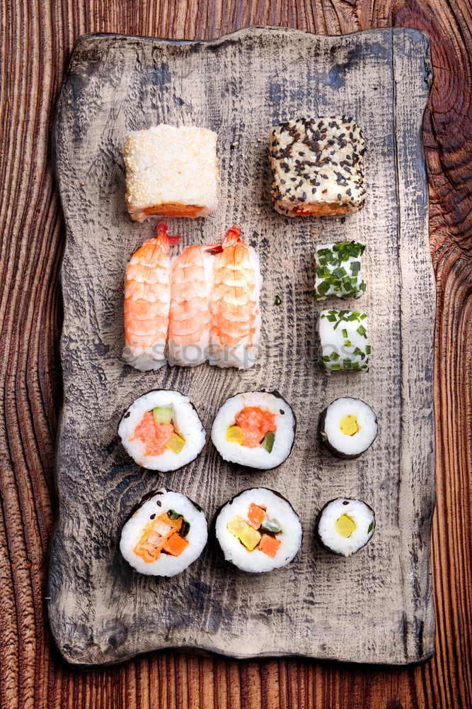 Similar – Image, Stock Photo Sushi set on pottery plate with chopsticks and soy sauce