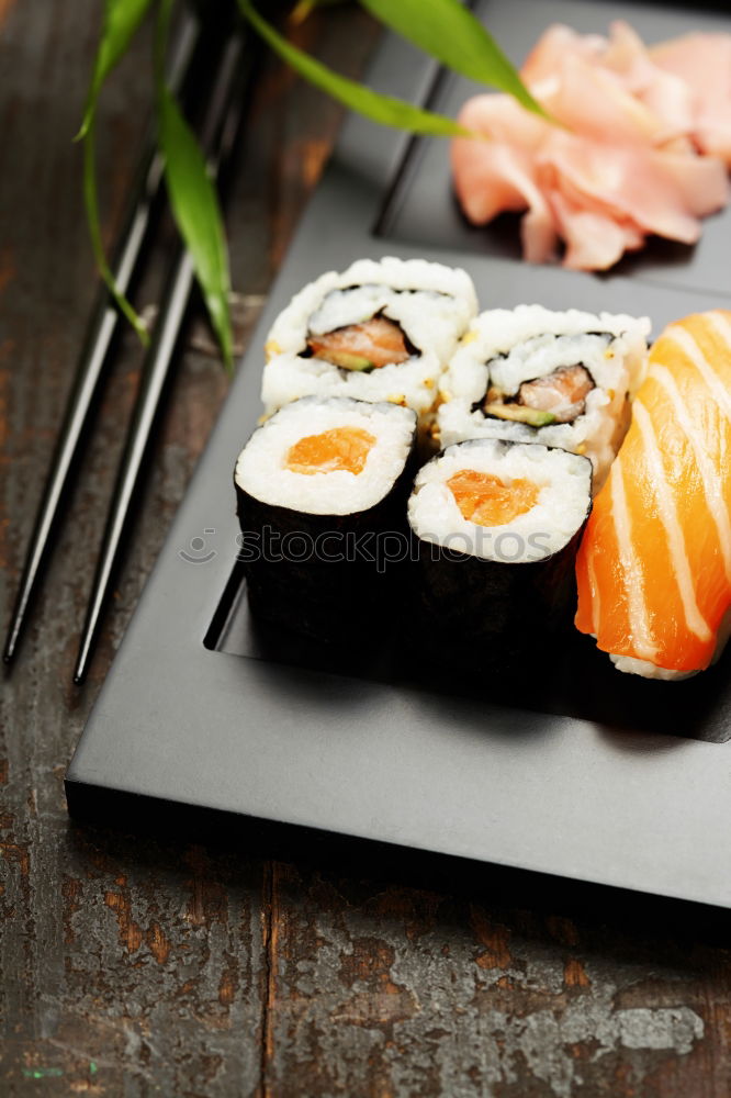 Similar – Japanese food: maki and nigiri sushi set on black background.