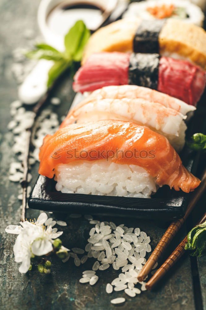 Similar – Crop woman eating sushi