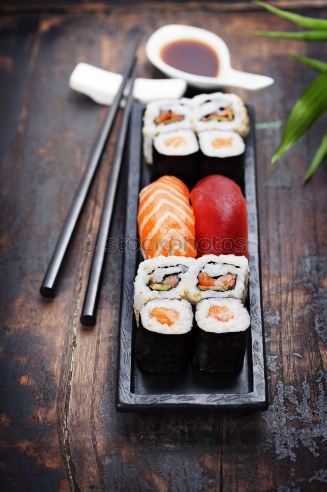 Similar – Crop woman eating sushi