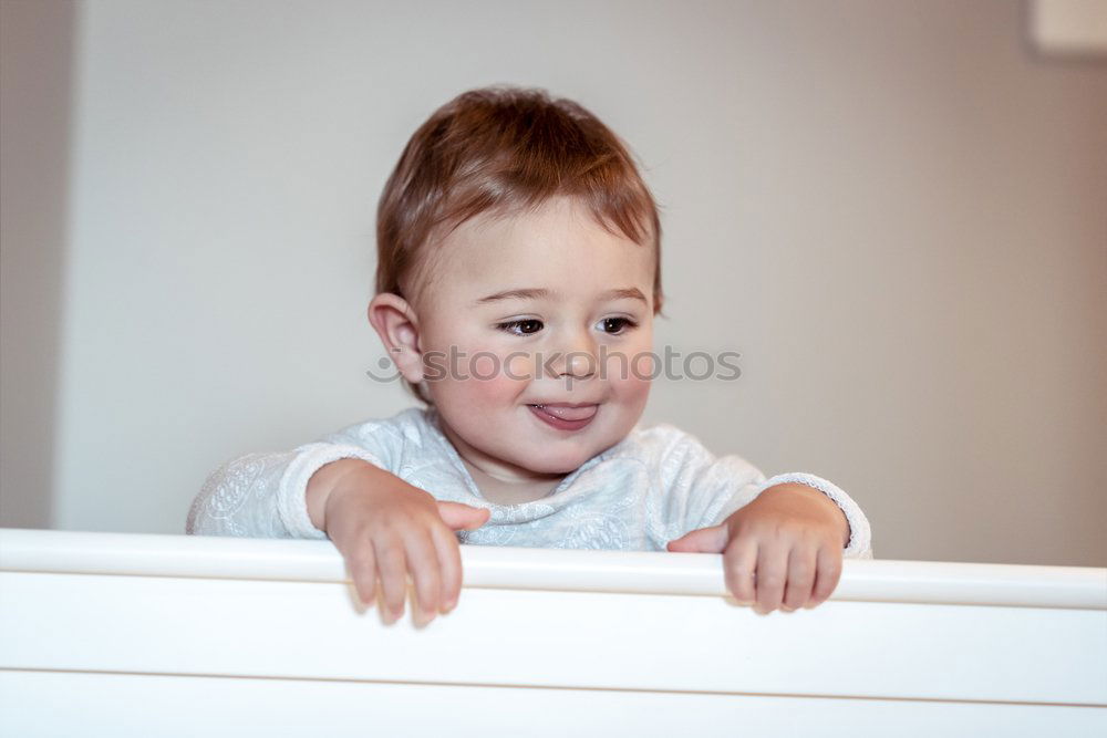 Similar – cute happy baby boy awake in his bed in the morning