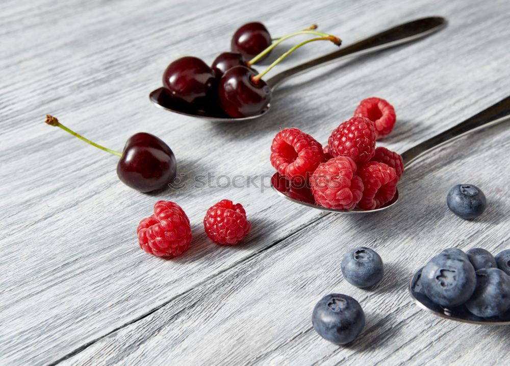 Similar – Image, Stock Photo Blue and raspberries on slate plate