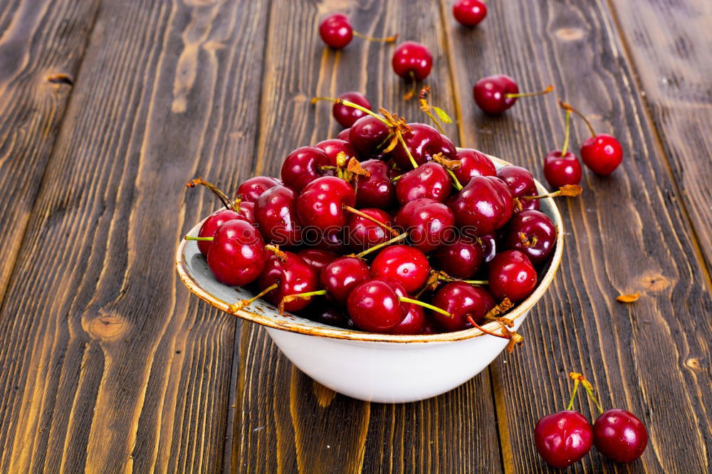 Similar – Image, Stock Photo Ripe red cherry in a paper bag