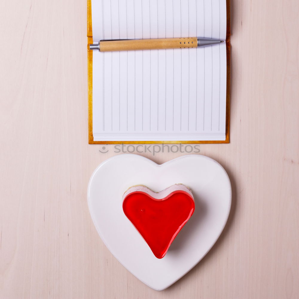 Two mobile phone displays form a heart.