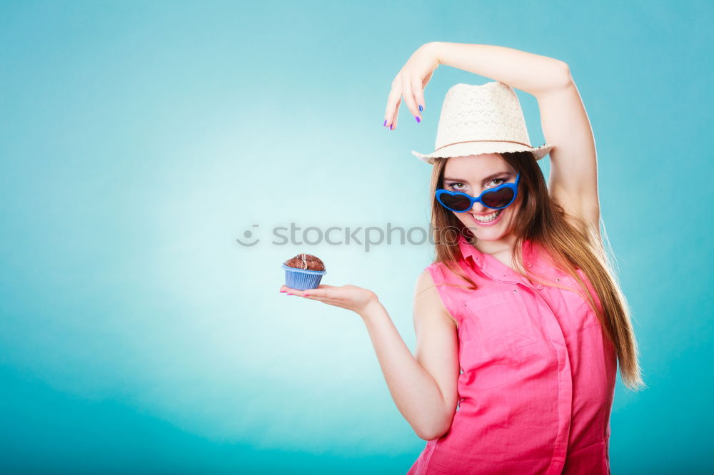 happy boy drinking orange juice on blue background