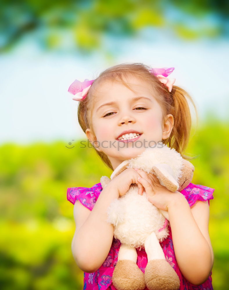 Similar – Young girl cuddles stuffy