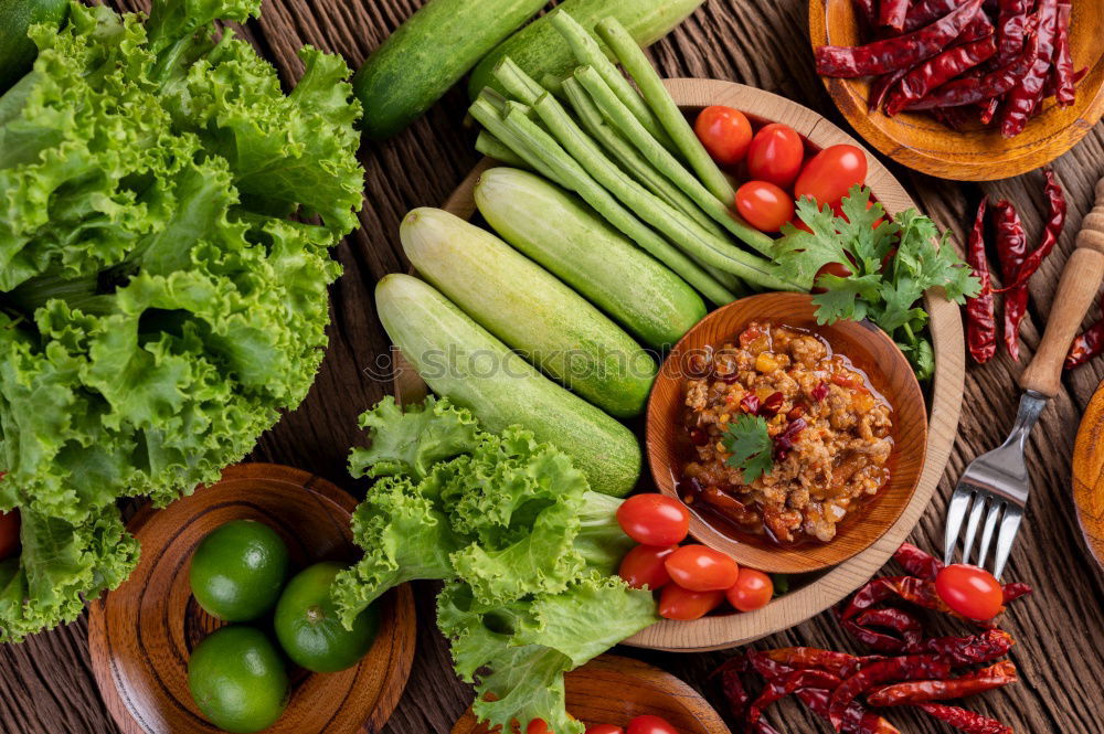 Vegetables and utensils on kitchen table