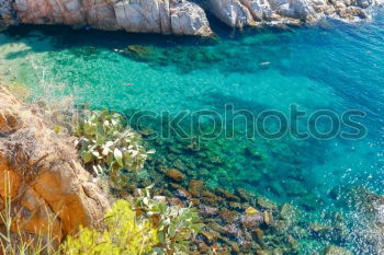 Similar – Boat anchors in rocky bay with turquoise blue sea from above