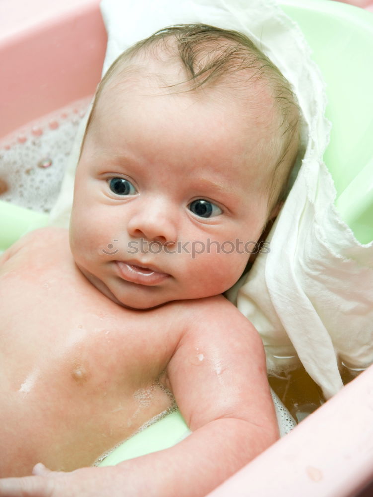 Similar – Bathing newborn baby girl.