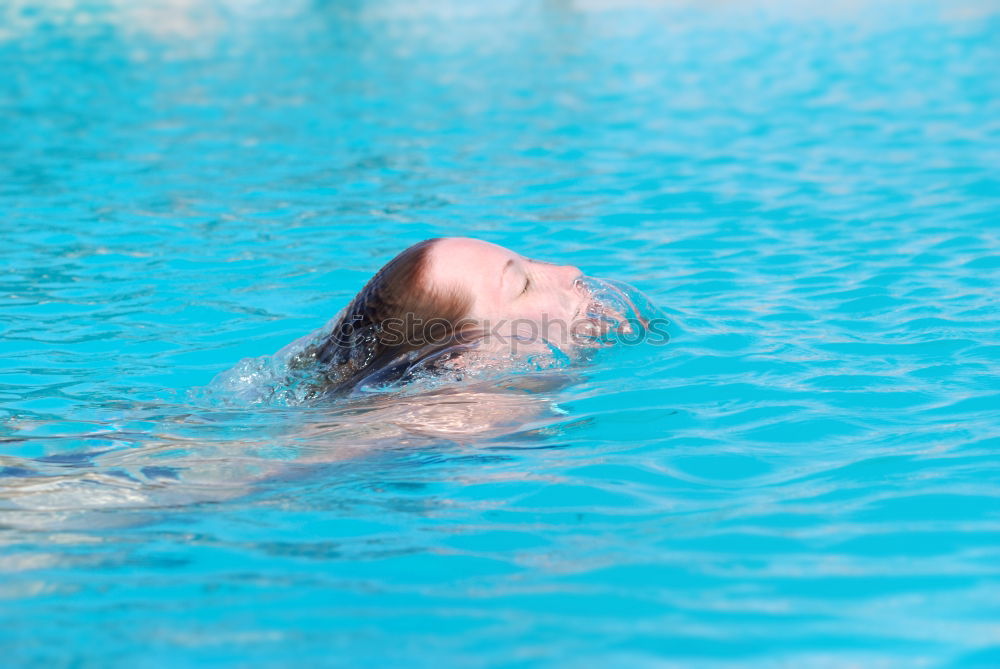 Similar – Unterwasseraufnahme. Körper  einer schlanken  jungen Frau Im Badeanzug  im Schwimmbecken