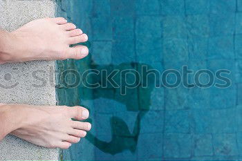 Similar – Man feet in the pool water