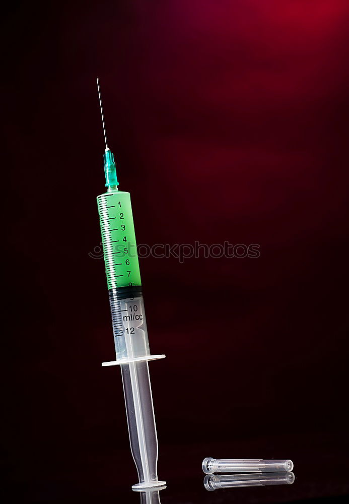 Similar – Small bottle of medicine and syringe on blue background