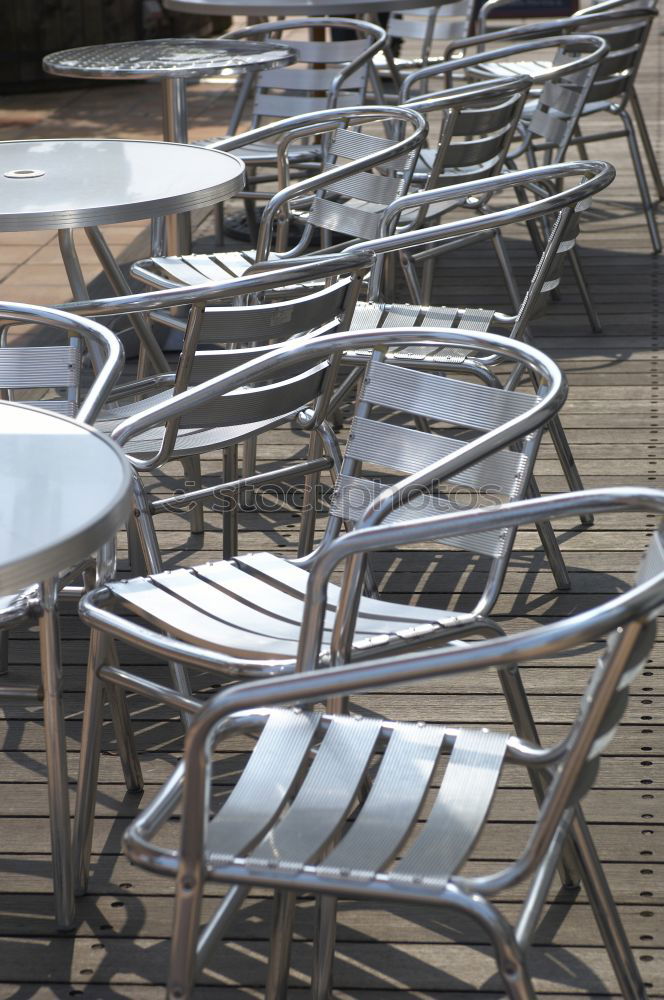 Similar – Image, Stock Photo Tables with flowers and chairs of an outdoor restaurant