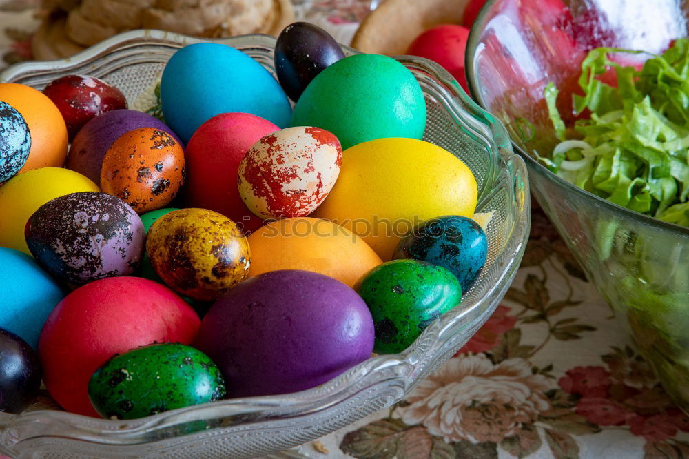 Similar – colorful Easter eggs next to natural brown chicken eggs