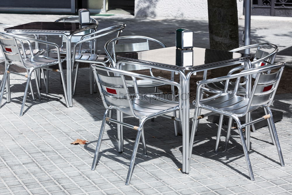 Similar – Image, Stock Photo Tables with flowers and chairs of an outdoor restaurant