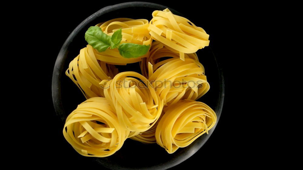 Similar – Raw tagliatelle on dark table