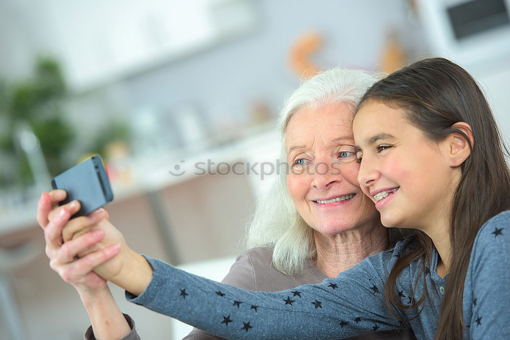 Similar – mature woman taking a selfie with smartphone