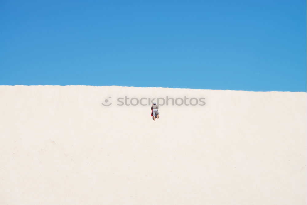 Similar – Image, Stock Photo Anonymous man walking on sand hills