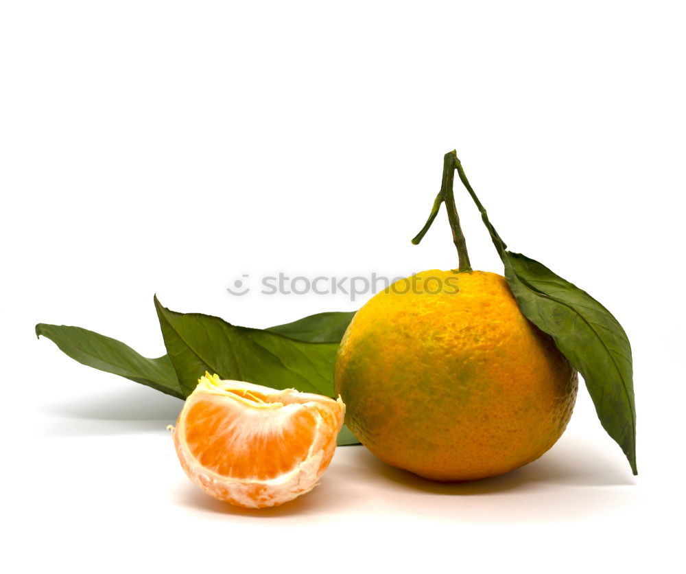 Similar – Orange fruit with green leaves on white wood