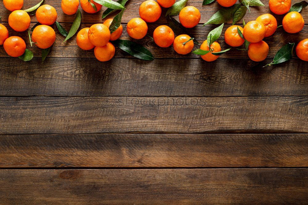 Similar – Image, Stock Photo Fresh mandarins with leaves on dark background