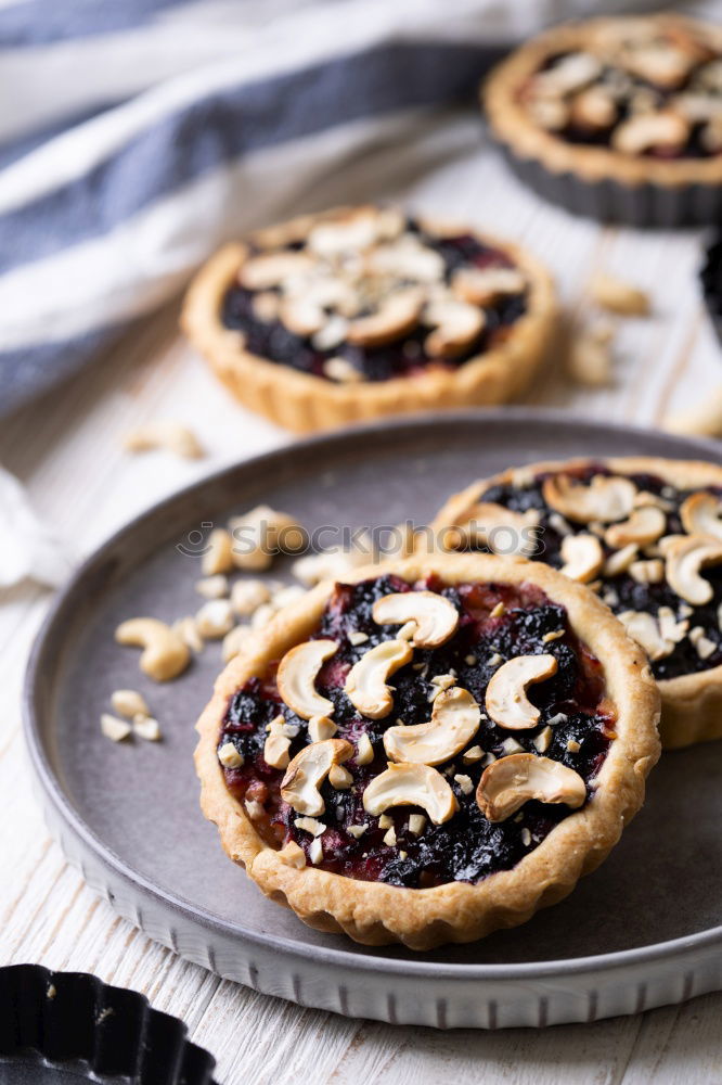 Similar – Delicious tartlets with raspberries and blueberries