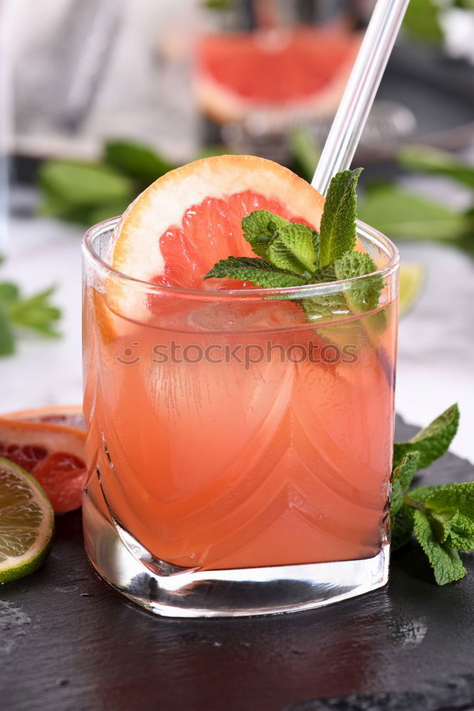 Similar – Two glasses of soft drink with honey- and watermelon, rosemary, ice cubes and drinking straw