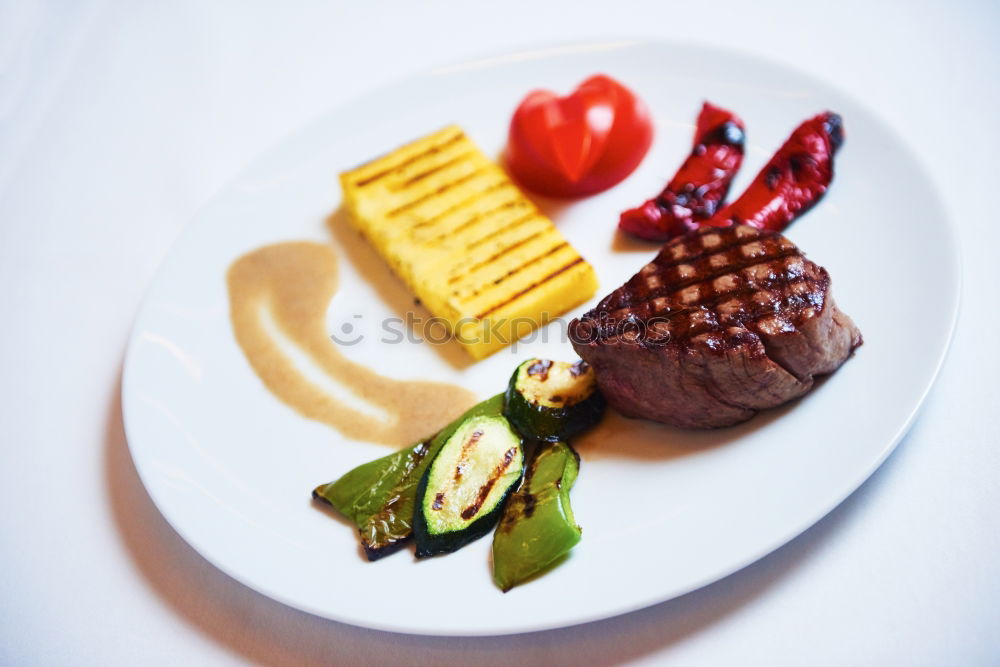 Similar – dinner with beef on a pure white dinner plate