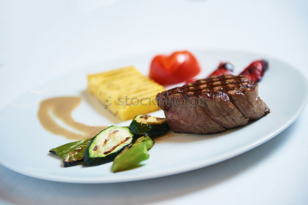 dinner with beef on a pure white dinner plate