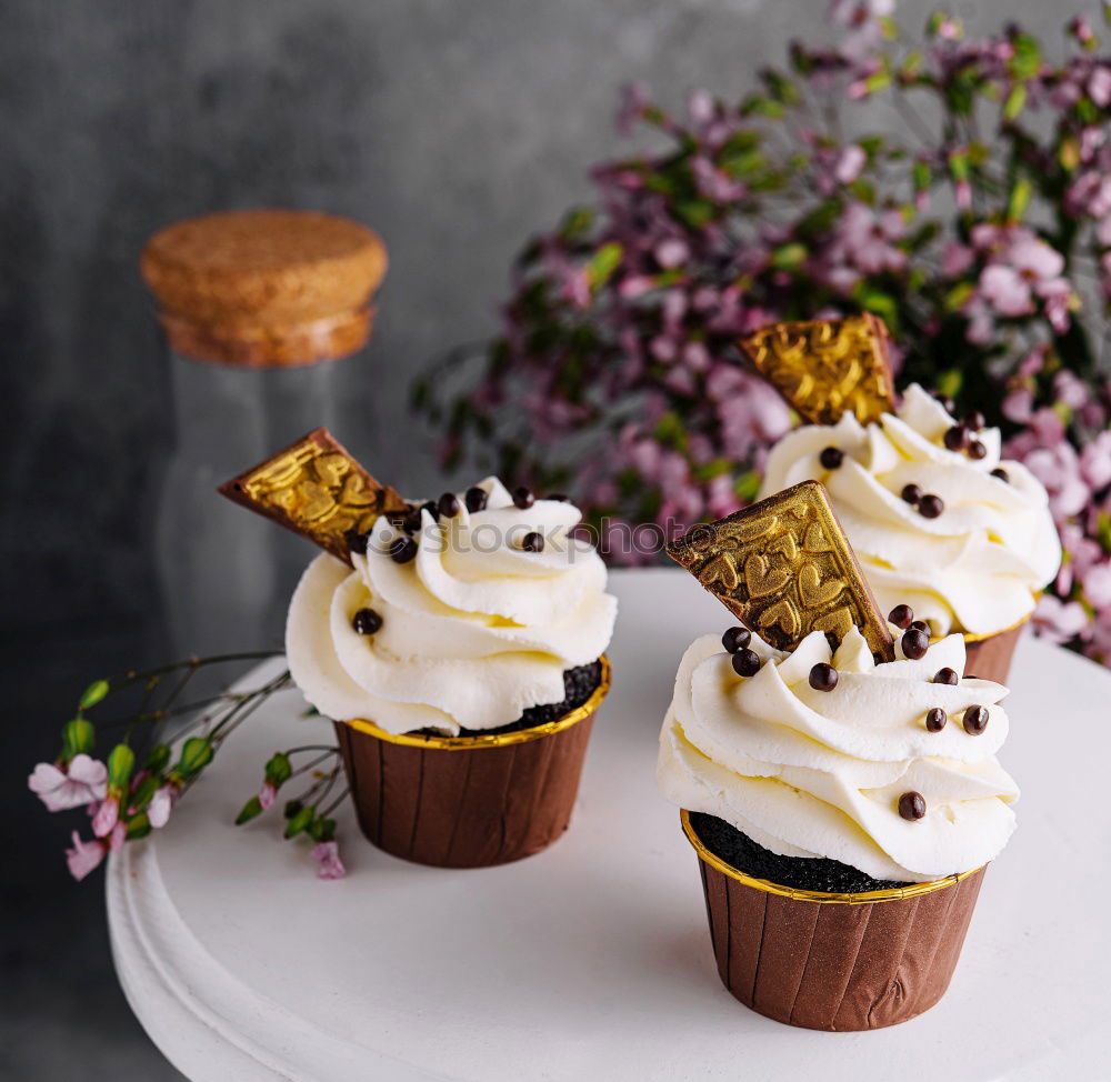 Similar – Image, Stock Photo white etagere with chocolate cake muffin and its preparation