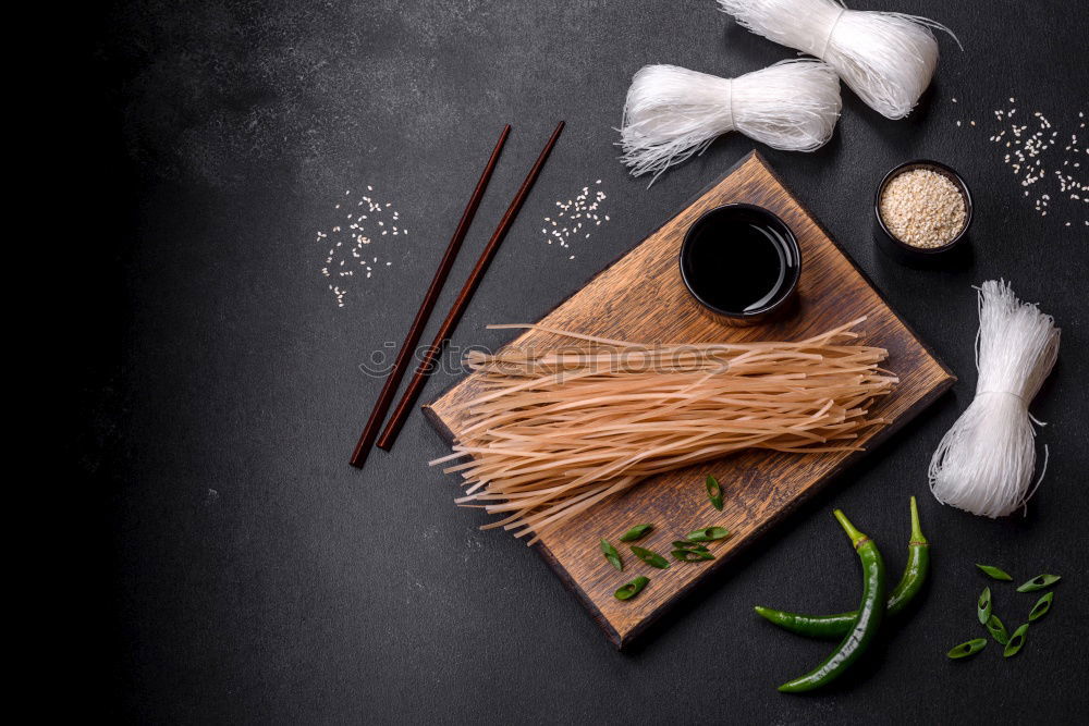 Similar – Foto Bild Eine Person sitzt mit Essstäbchen in der Hand vor einer leckeren Pho Suppe in Vietnam