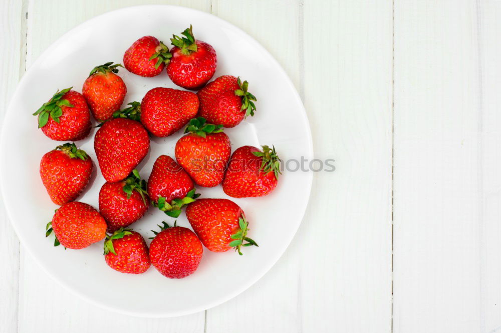 Similar – Strawberries in a bowl on a white wooden table