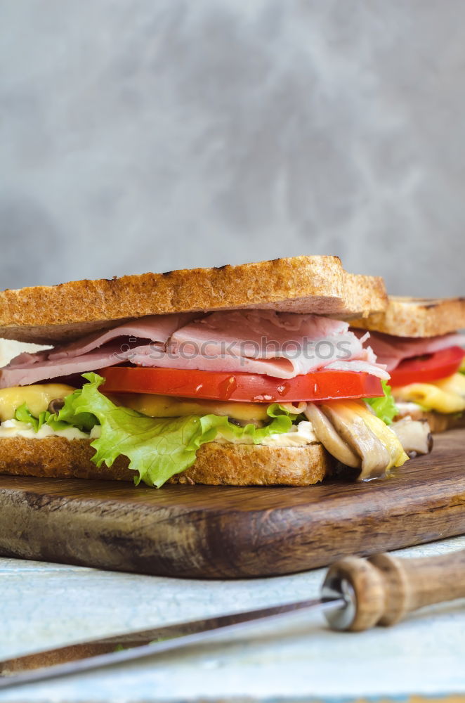 Similar – Image, Stock Photo Fresh healthy sandwich with bread, ham and vegetables.