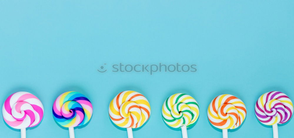 Similar – Colorful lollipop on blue background. Top view. Copyspace