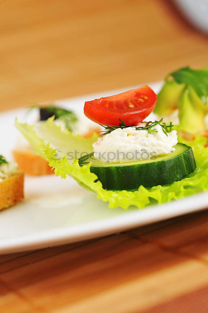 Similar – Homemade breakfast: bread with cheese, ham and lettuce, with app