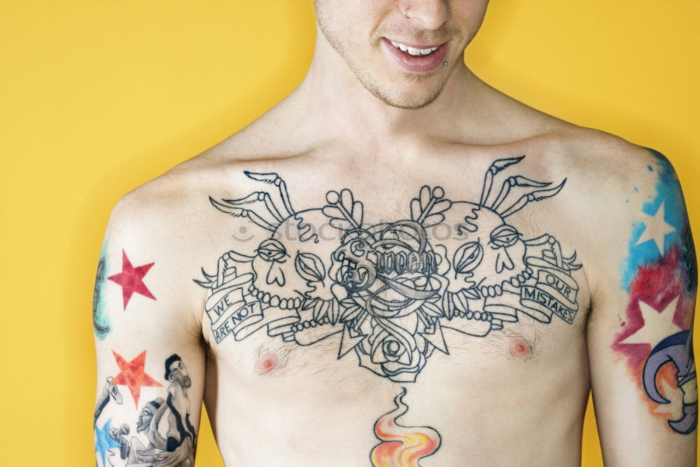 Similar – Image, Stock Photo young man spreads his arms like an angel while leaning against the wall with a tattoo on his bare chest