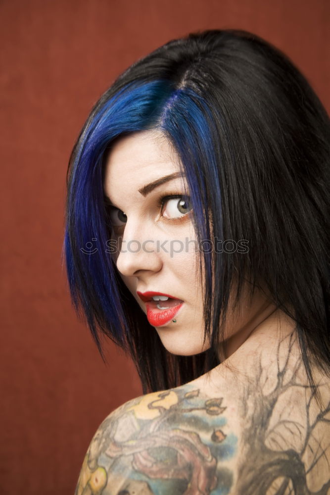 Similar – analog rectangular portrait of young woman with purple hair in front of green steel sheet wall