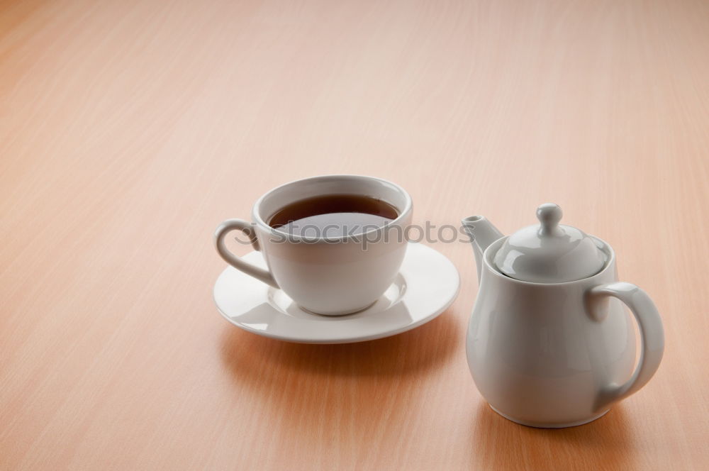 Similar – Two hands holding full cups of coffee and green tea