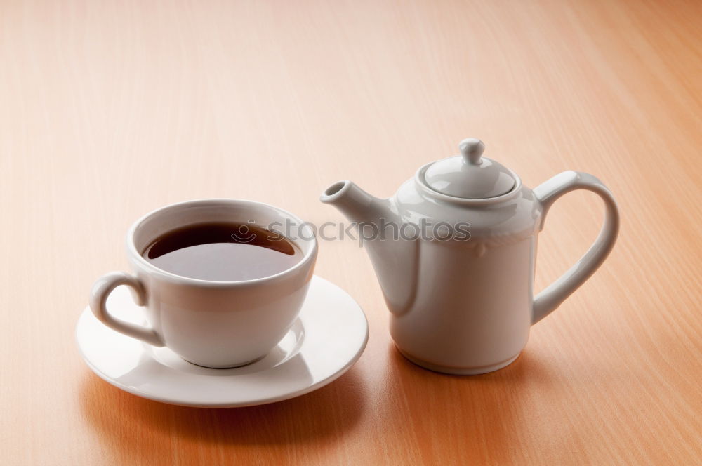 Similar – Two hands holding full cups of coffee and green tea