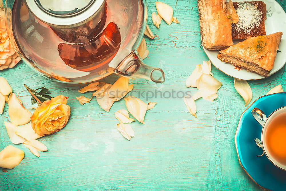 Similar – Tea brunch with coloured teacups, teapot and cake