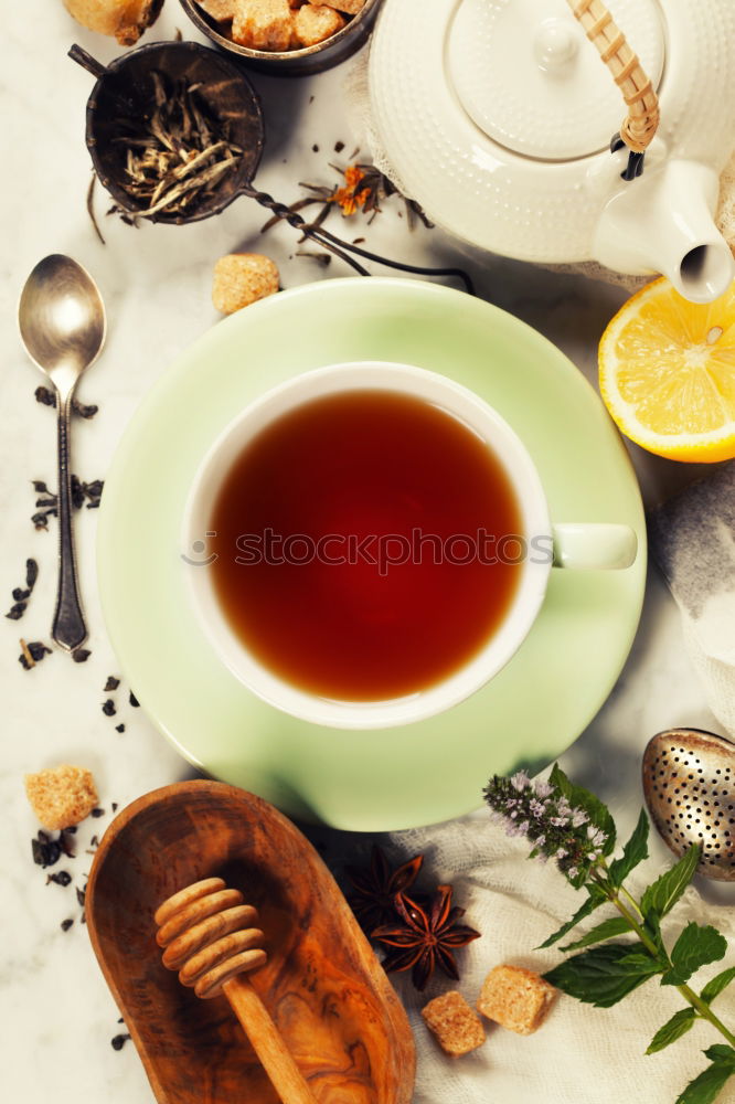 Similar – Tea brunch with coloured teacups, teapot and cake