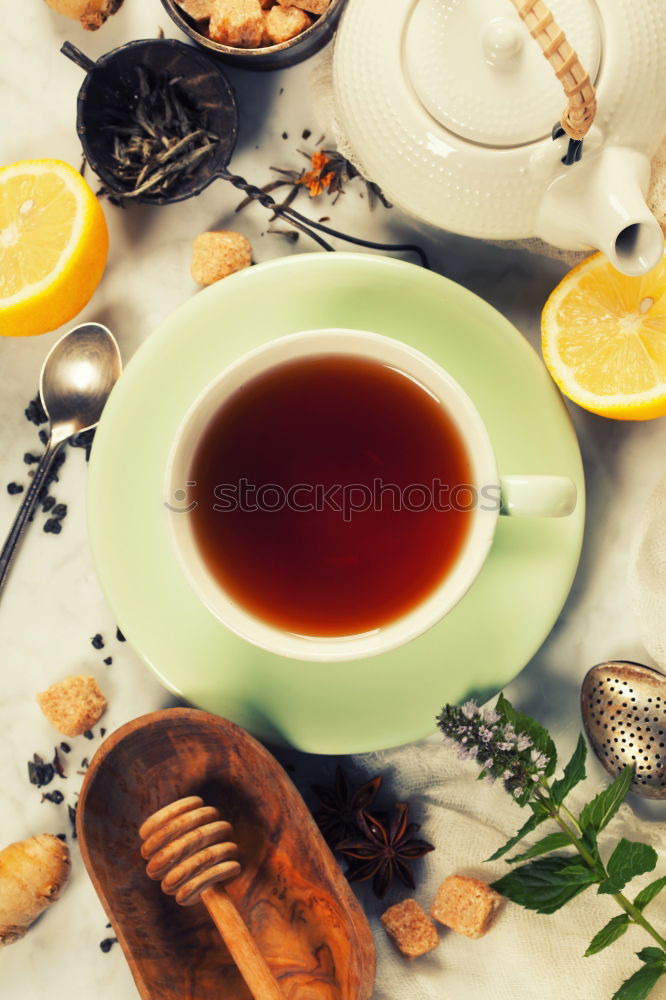 Similar – Tea brunch with coloured teacups, teapot and cake