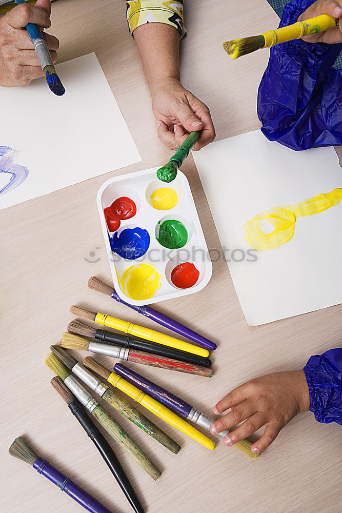 Similar – Image, Stock Photo Girl coloring a simple sketch of a skull