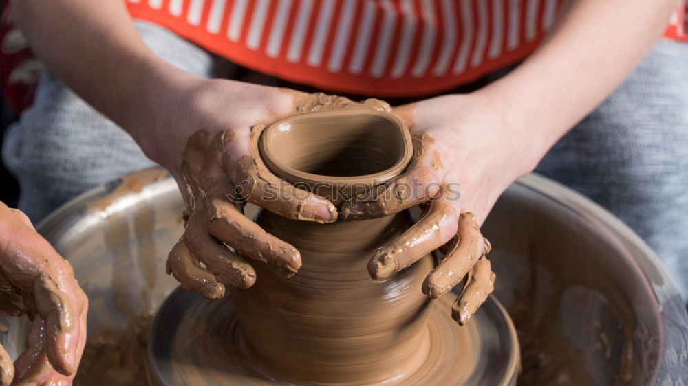 Similar – Potter making the pot in traditional style. Close up.