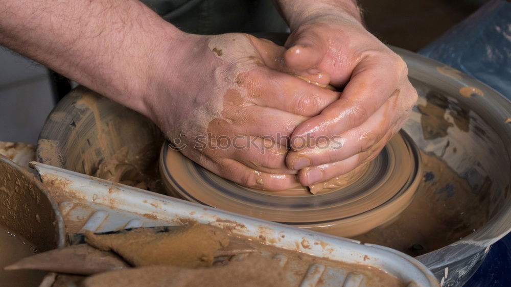 Similar – Female hands forming clay pot