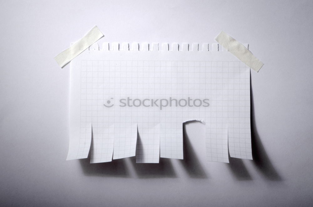 Similar – torn in half white blank sheet in line on blue background